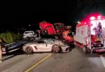 Acidente grave entre caminhão e carreta com veículos de luxo deixa um morto